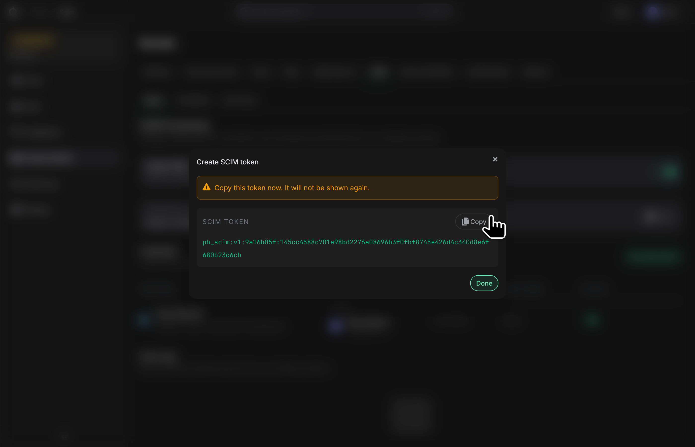SCIM token shown once after creation